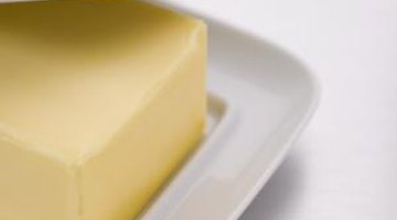 The oils in butter help break down the ink stain.